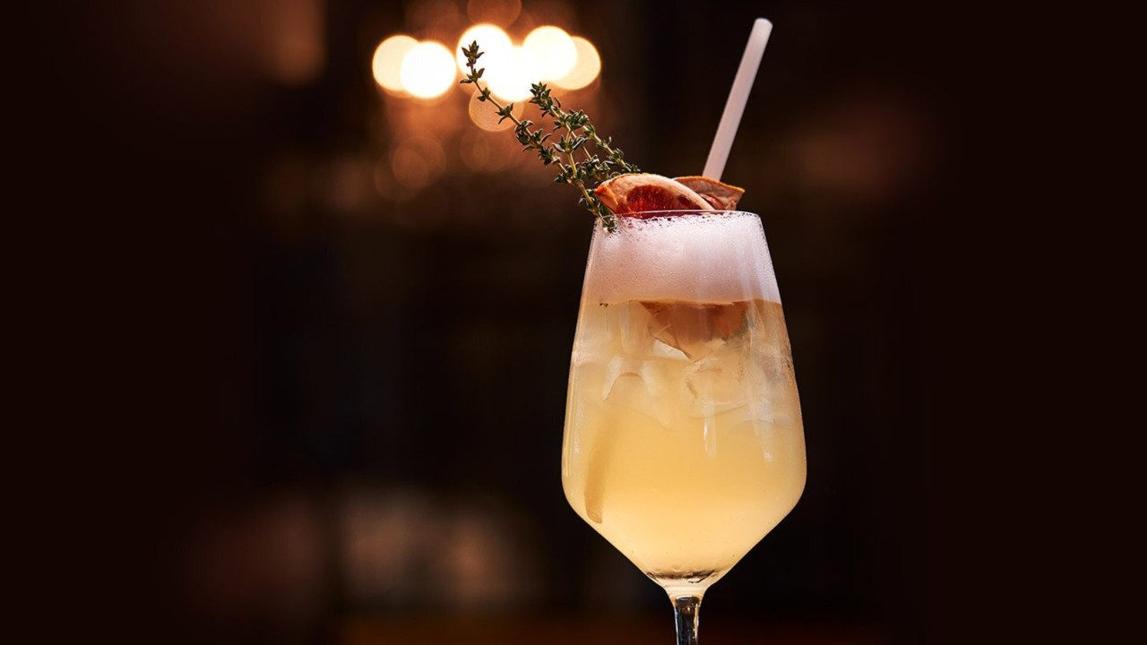 Handcrafted cocktail at Bread Street Kitchen overlooking the Merlion