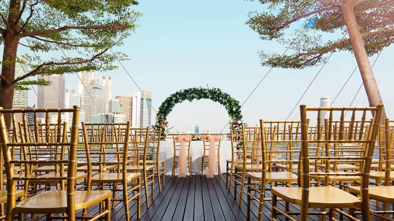 Couple planning and holding their wedding ceremony at Marina Bay Sands, Singapore