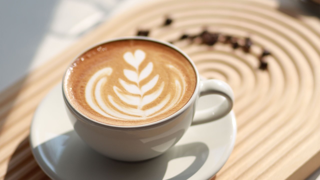 Cup of latte with latte art, the best coffee to get in Singapore