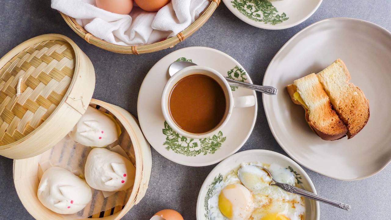 Traditional Singapore kopi with soft-boiled eggs and kaya toast